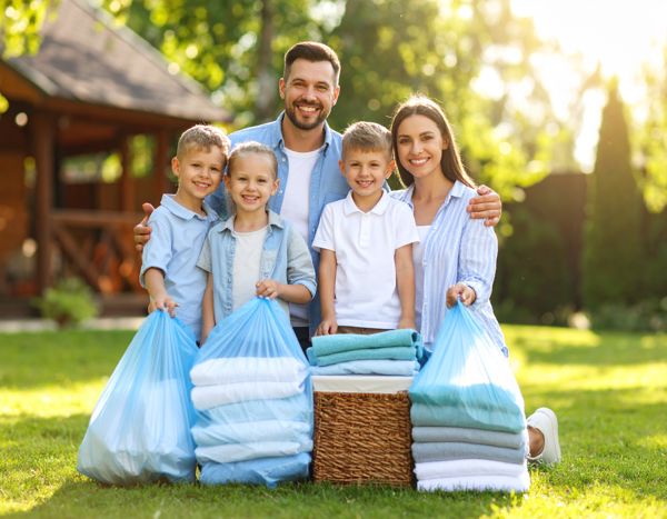 Firefly Happy Family Outside Of Home, Sunny Day, Clear Bags Of Clean Laundry Stacked Near The 557741